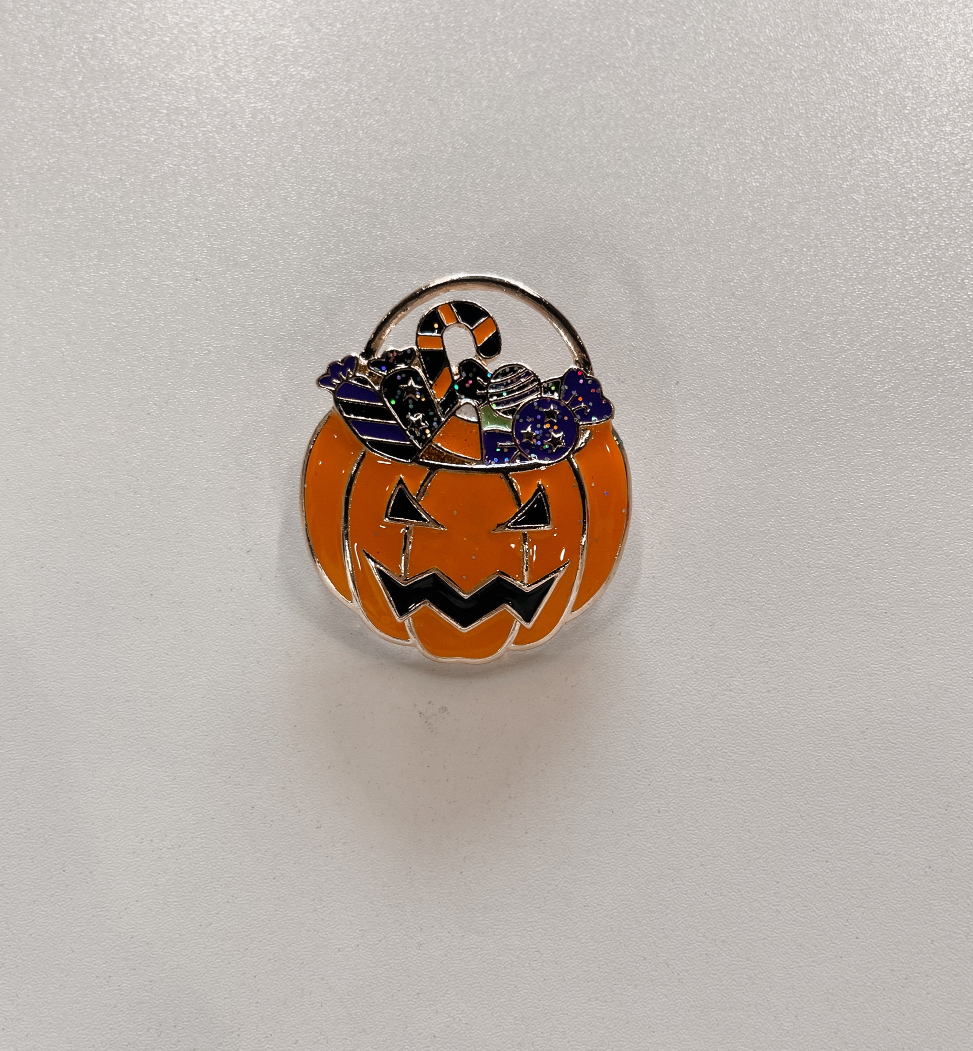 Jack-o’-lantern candy pale pin